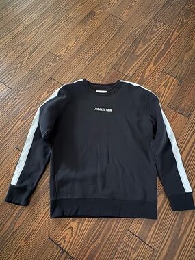 Hollister Men's Black Crewneck Sweater with White Sleeve Stripes